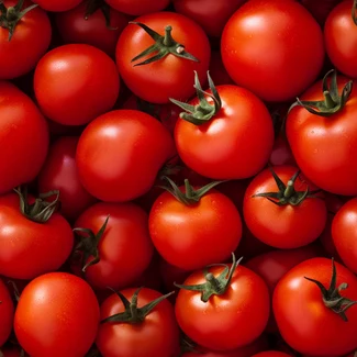 A pile of juicy red tomatoes on a textured surface